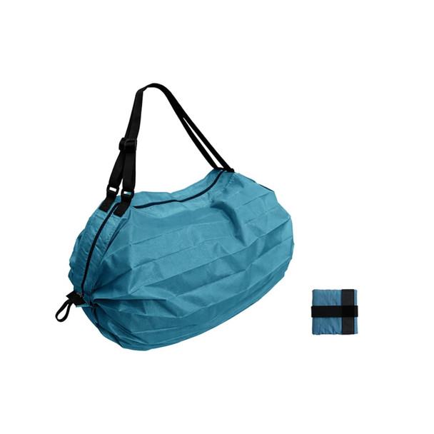 A foldable shopping shoulder bag in a light blue colour, featuring black straps and a compact folded version beside it.