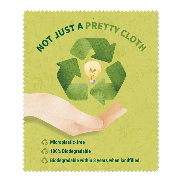 A biodegradable lens cloth in green with a recycling symbol and light bulb graphic. It has a textured, eco-friendly design.