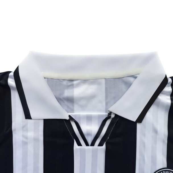 Black and white striped unisex polo jersey with a collar and a branding logo on the chest.