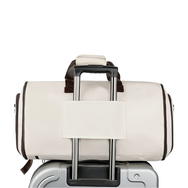 A convertible backpack duffel garment bag in cream and brown, attached to a silver suitcases' handle.