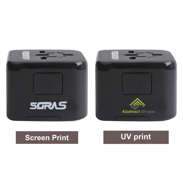 A universal travel adapter with USB-C ports in black, featuring two different print designs and a logo on each side.