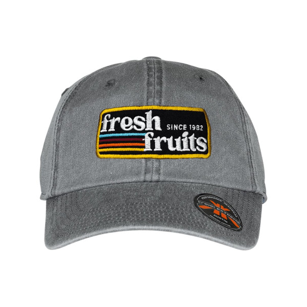 A grey organic washed cotton cap featuring an embroidered logo. The cap has a curved brim and an adjustable strap.
