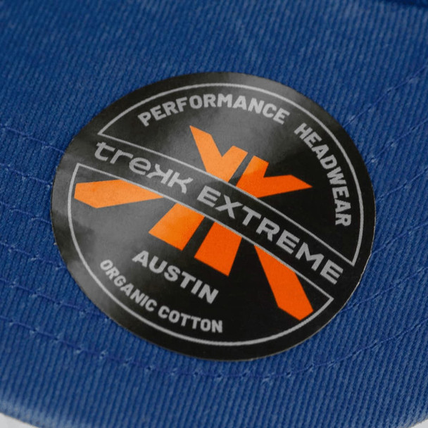 A blue organic cotton cap featuring a logo on the front.