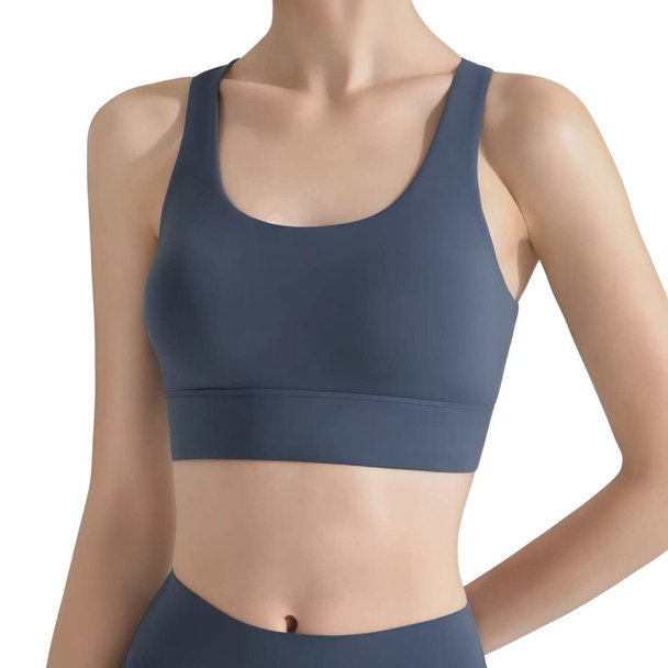 A women's cross back yoga crop bra tank in a dark blue hue, featuring a sleek and minimalistic design.