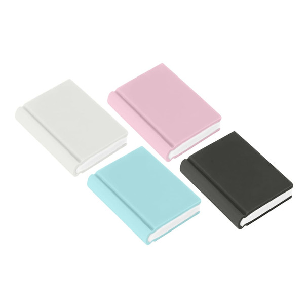 A collection of book-shaped rubber erasers in white, pink, light blue, and black. Each eraser resembles a small book.
