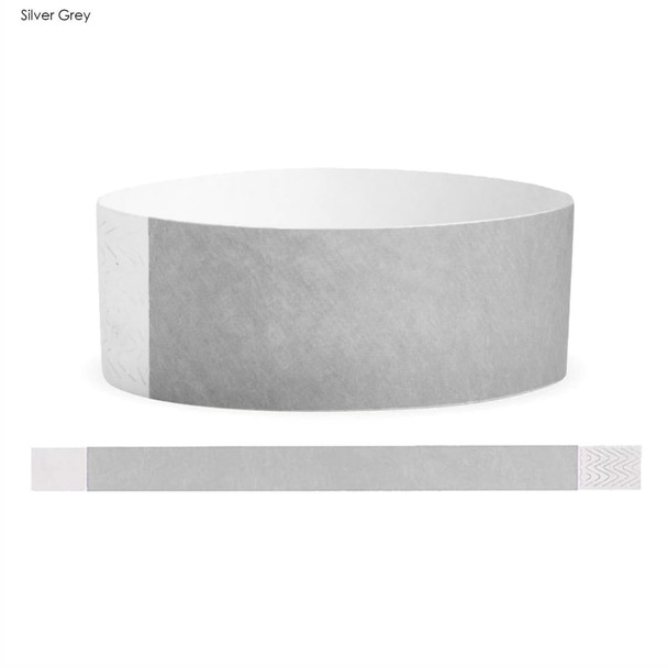 A silver grey Tyvek adult wristband with a smooth texture and integrated branding.