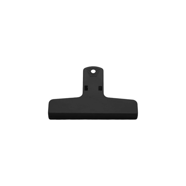 A black plastic magnetic clip with a wide grip and a hole for hanging. It features a simple, functional design.