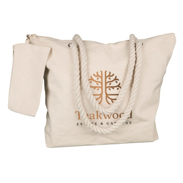 A cream tote bag with a rope handle and a zippered pocket, featuring a logo on the front.