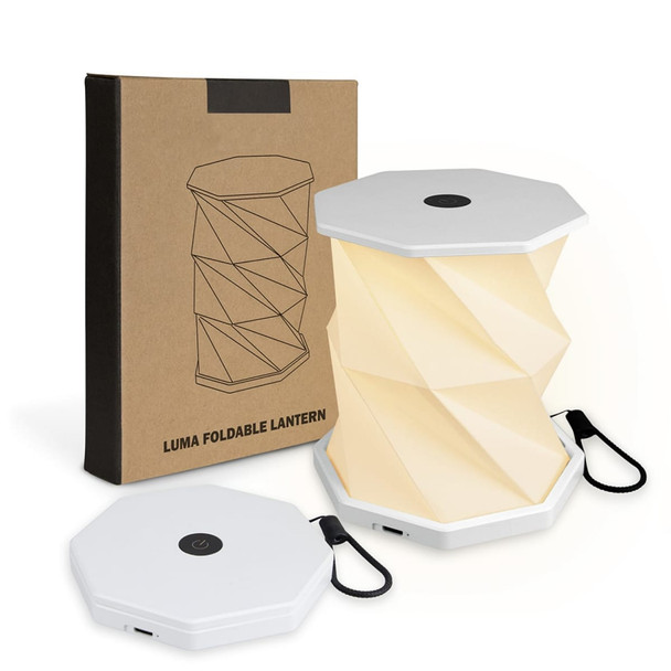 A foldable lantern in white, displayed with its packaging, featuring a unique twisted design.
