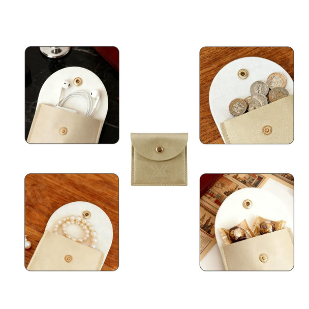 A square PU leather jewellery pouch in cream, featuring compartments for storing accessories and a gold press stud closure.