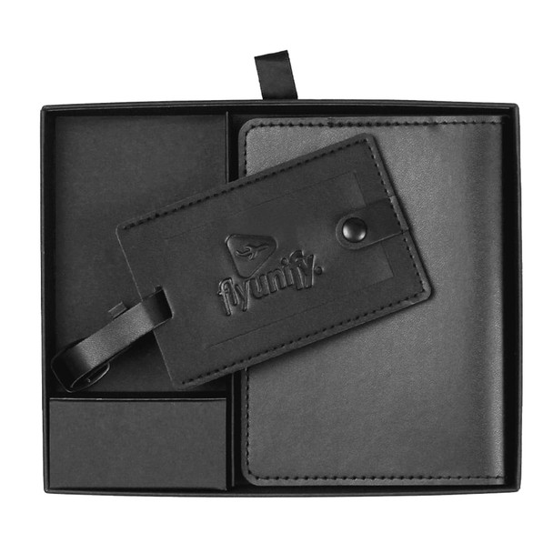 A black travel gift set featuring a luggage tag and a passport holder, presented in a sleek box with branding.