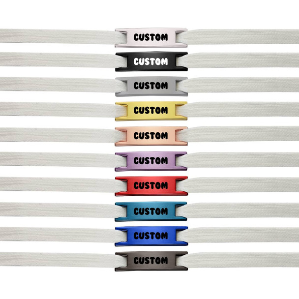 A row of white shoelaces with various coloured charms, featuring a logo and the word "CUSTOM" on each charm.