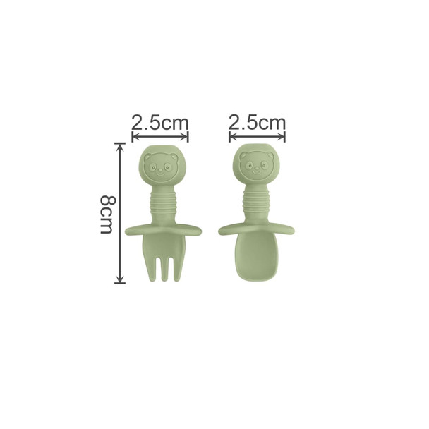 A set of green silicone cutlery for kids, featuring a bear-shaped handle with a fork and spoon.