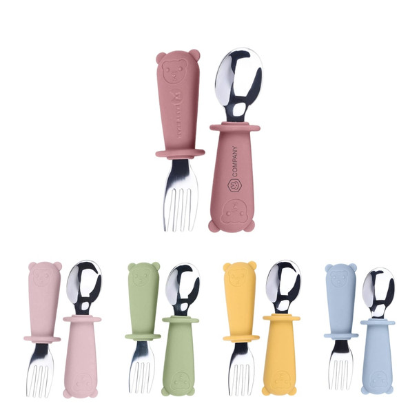 A set of silicone and stainless steel kids cutlery in pink, green, blue, and yellow, featuring bear-shaped handles.