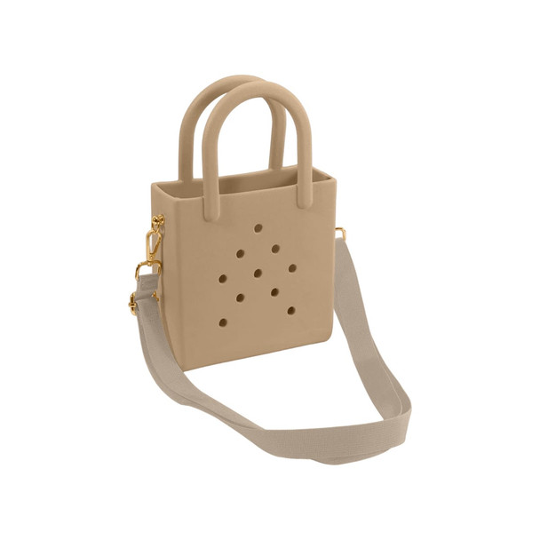 A tan mini beach bag with perforated detailing, featuring two handles and an adjustable shoulder strap.