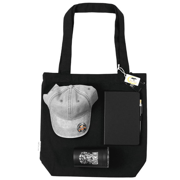 A black tote bag containing a grey cap, a notebook, a pen, and a glass tumbler.