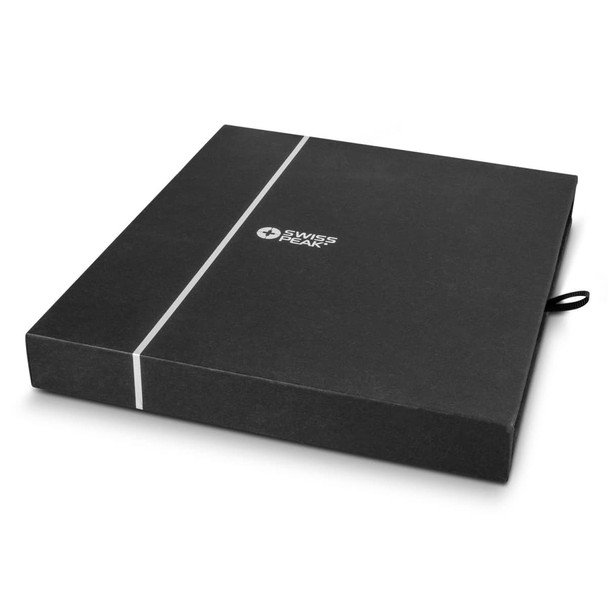 A black presentation box with a ribbon, containing a notebook and pen set. The box features a branding logo.