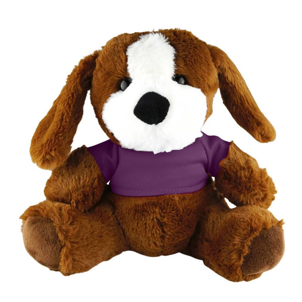 A brown plush dog with floppy ears, featuring a white patch on its face and dressed in a purple shirt.