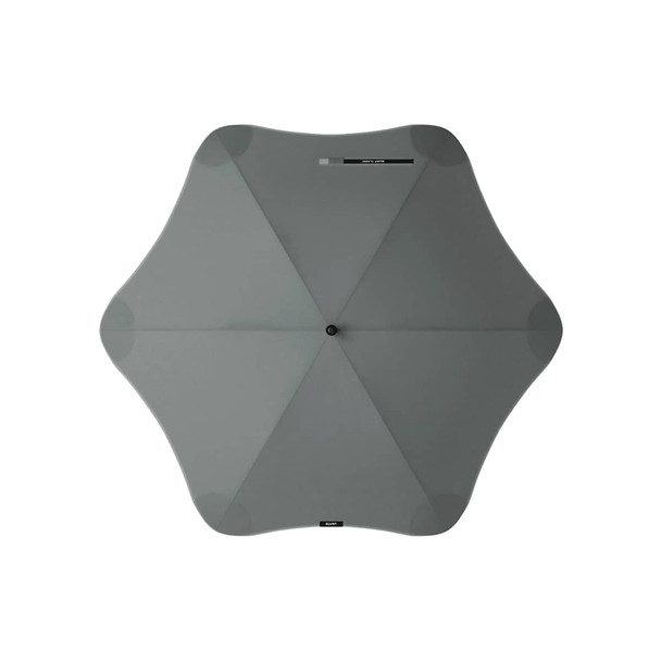 A grey BLUNT Classic Umbrella with a unique star-like shape and a central button. It features a logo.