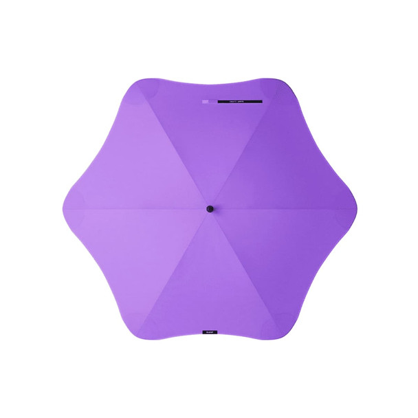 A purple BLUNT Classic Umbrella with a unique star-shaped canopy and a central hub. It features branding on the handle.
