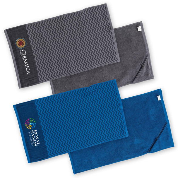 Three gym towels in grey and blue, featuring different textured patterns and branding.
