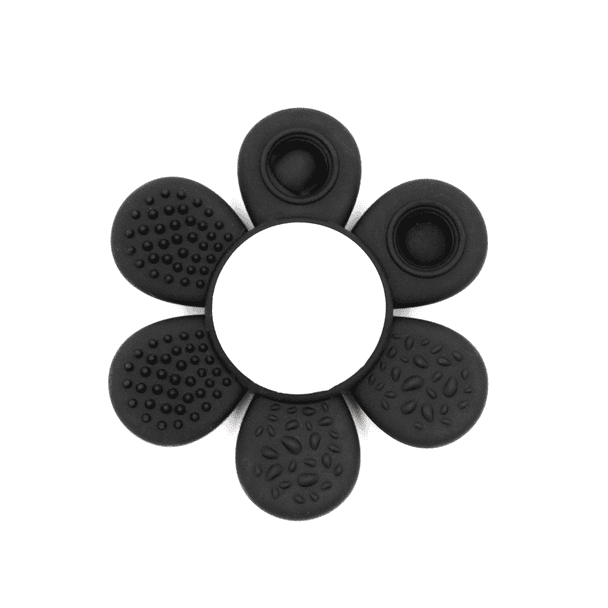 A black silicone product shaped like a flower with various textured petal designs and a central circular opening.