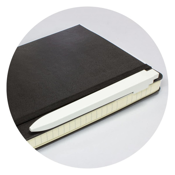 A black notebook with a white pen resting on the edge. The notebook features a textured cover and a band.