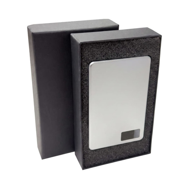 A power bank with a sleek silver finish, presented in a black packaging box.