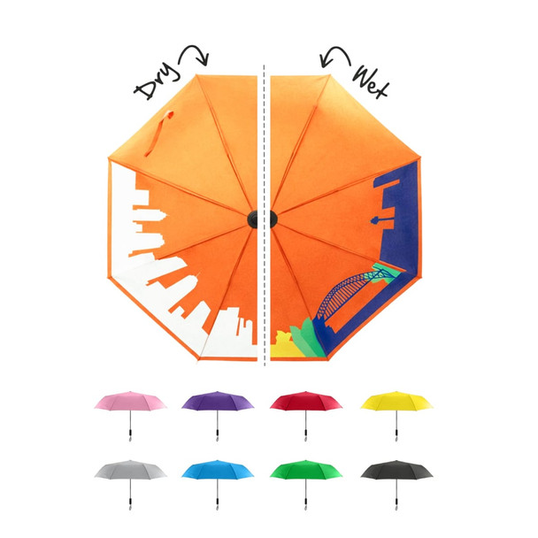 A 23'' colour changing umbrella displays an orange exterior with a skyline design, revealing vibrant colours when wet.