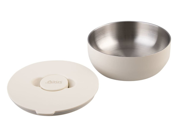An insulated lunch bowl in cream colour featuring a stainless steel interior and a matching lid. It has a logo.