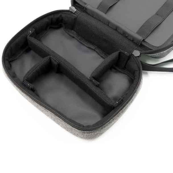 A grey toiletry bag with a zippered closure, featuring multiple inner compartments and a sleek black interior.