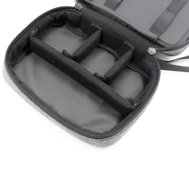 A grey toiletry bag with multiple compartments and a zip closure, featuring internal padding and organisation sections.