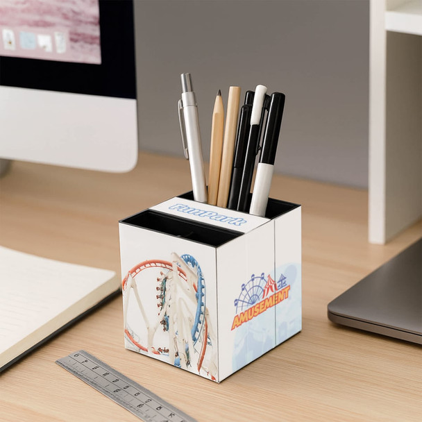 A three-panel foldable pen holder in white, featuring a colourful amusement park design, storing various pens and pencils.
