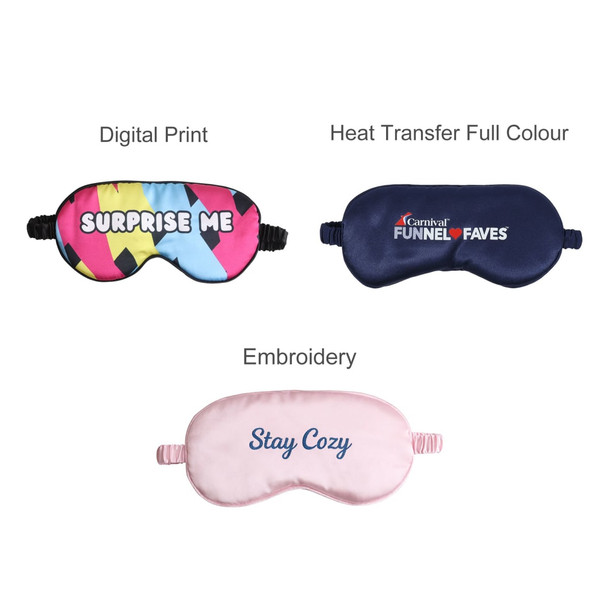 A collection of three satin sleep masks in multi-coloured, navy, and pink designs, each featuring different prints and branding.