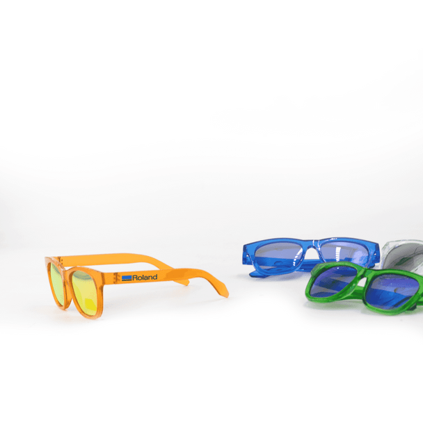 Brightly coloured sunglasses in orange, blue, and green, featuring a logo on one pair.