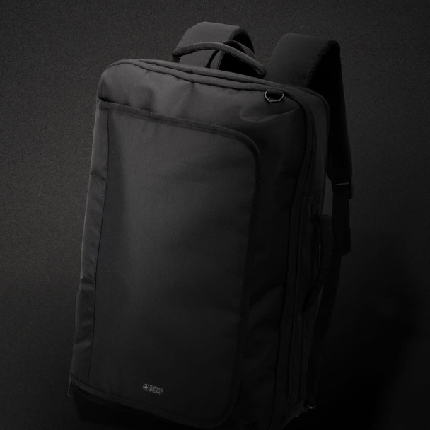 A black Swiss Peak convertible travel backpack with adjustable shoulder straps and a front compartment, featuring a logo.