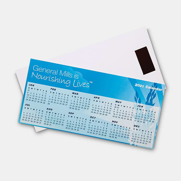 A blue magnetic calendar features monthly grids and is placed over a white envelope, showcasing a logo.