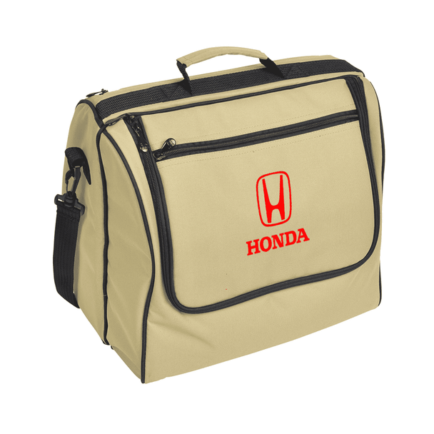 A beige picnic basket with a black trim and a front pocket, featuring a logo.