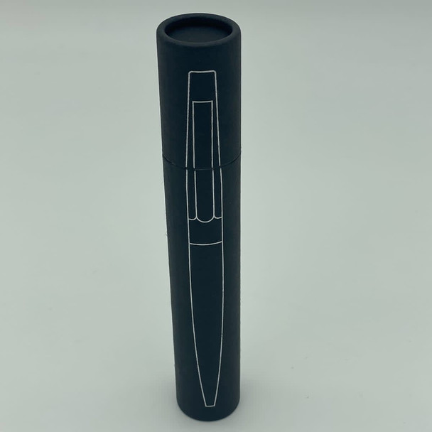 A metal pen presented in a sleek black cylindrical case with a logo.