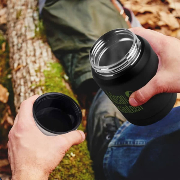 A drink bottle with a black exterior and silver interior, featuring a round opening and a logo.
