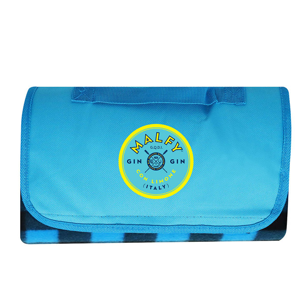 A blue picnic blanket with a folded design and a circular logo in the centre.