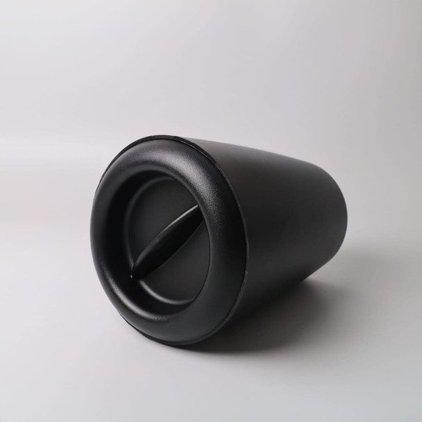 A black ice bucket with a sleek design, featuring a side opening and curved shape. It has a branding logo.