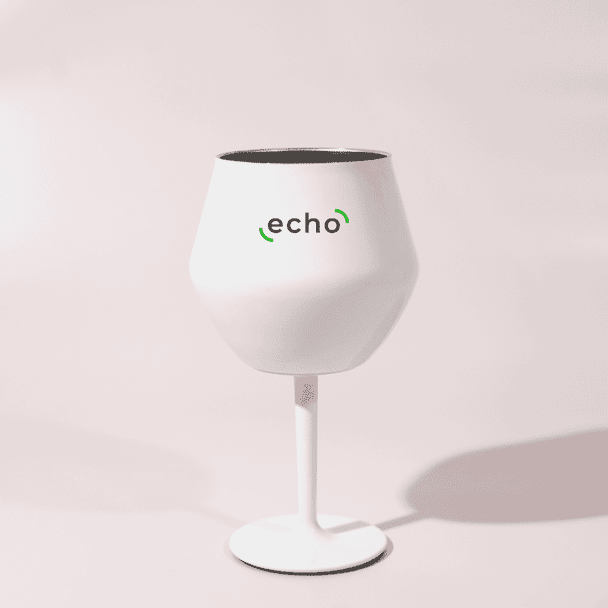 A white Shiraz detachable wine glass with a black interior and a stand, featuring a logo.