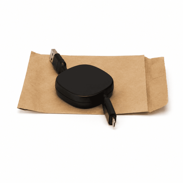 A black ZIP 60W fast charging cable with retractable design, placed on brown packaging. Contains a logo.