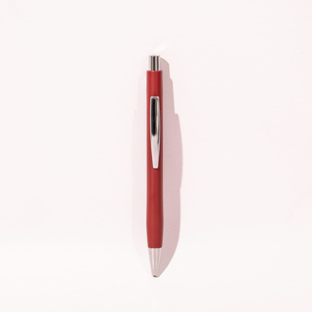 A red ballpoint pen with a silver clip, featuring a sleek design and a shiny finish.