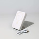 A white wireless charging power bank with a stand and a USB charging cable.