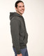 A man wearing a grey adult's close front contrast fleecy hoodie with a front pocket and a hood.