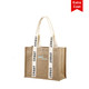 A jute tote bag in natural tones with cream handles and a logo. Features decorative straps with text.