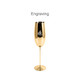 A gold stainless steel champagne flute with a sleek design and a logo on the side.
