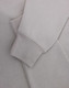 A light grey polar fleece jumper featuring a half zip collar and fitted cuffs. It has a subtle logo.